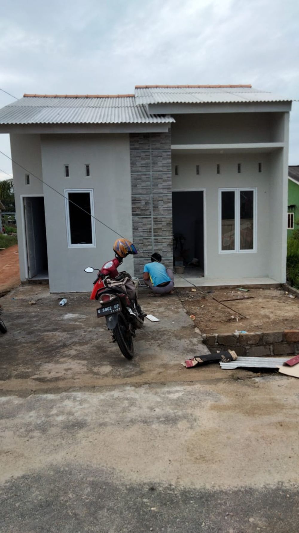 foto tampak rumah tipe CLUSTER perumahan BUMI KAMPAK PERMAI