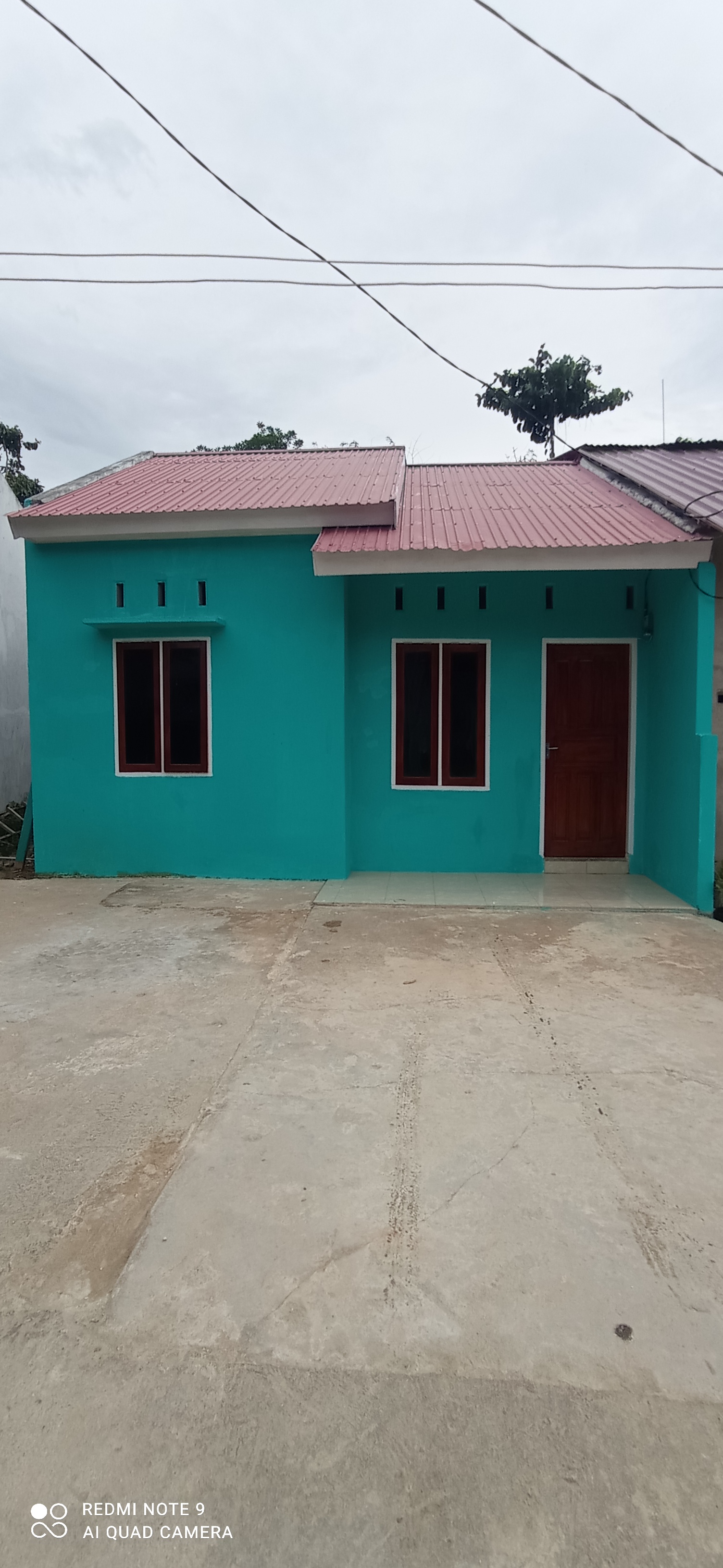 foto tampak rumah tipe 36/128 perumahan GRIYA MANDALA BARUGA