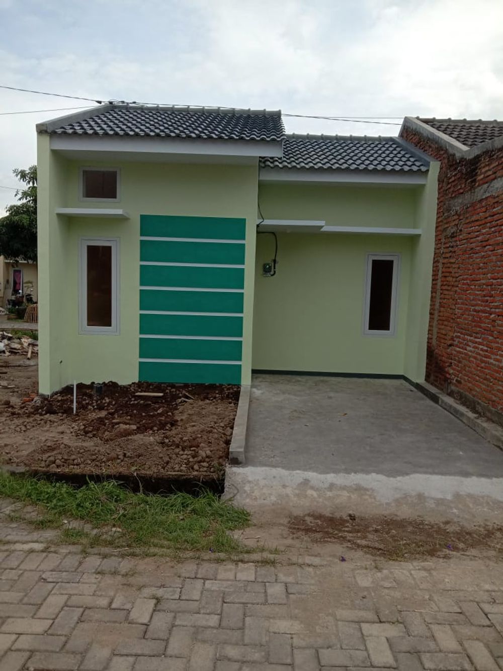 foto tampak rumah tipe 27 perumahan Sriwijaya Land