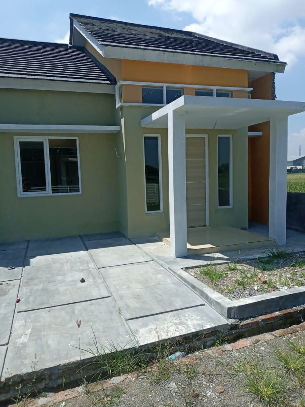 foto tampak rumah tipe 45 perumahan Cluster Munjungagung Asri