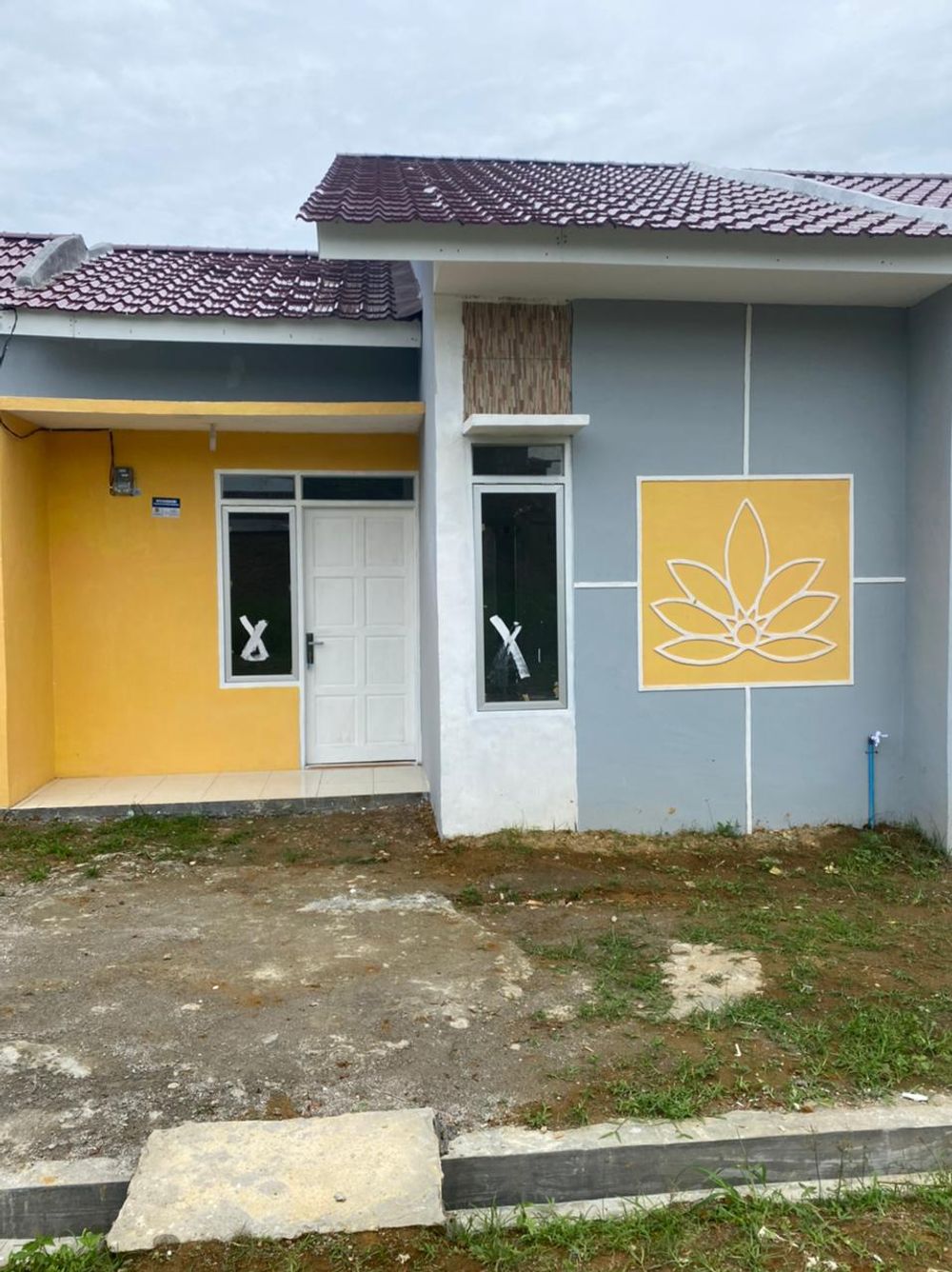 foto tampak rumah tipe 36 perumahan Cluster  Taman Deli  Kencana