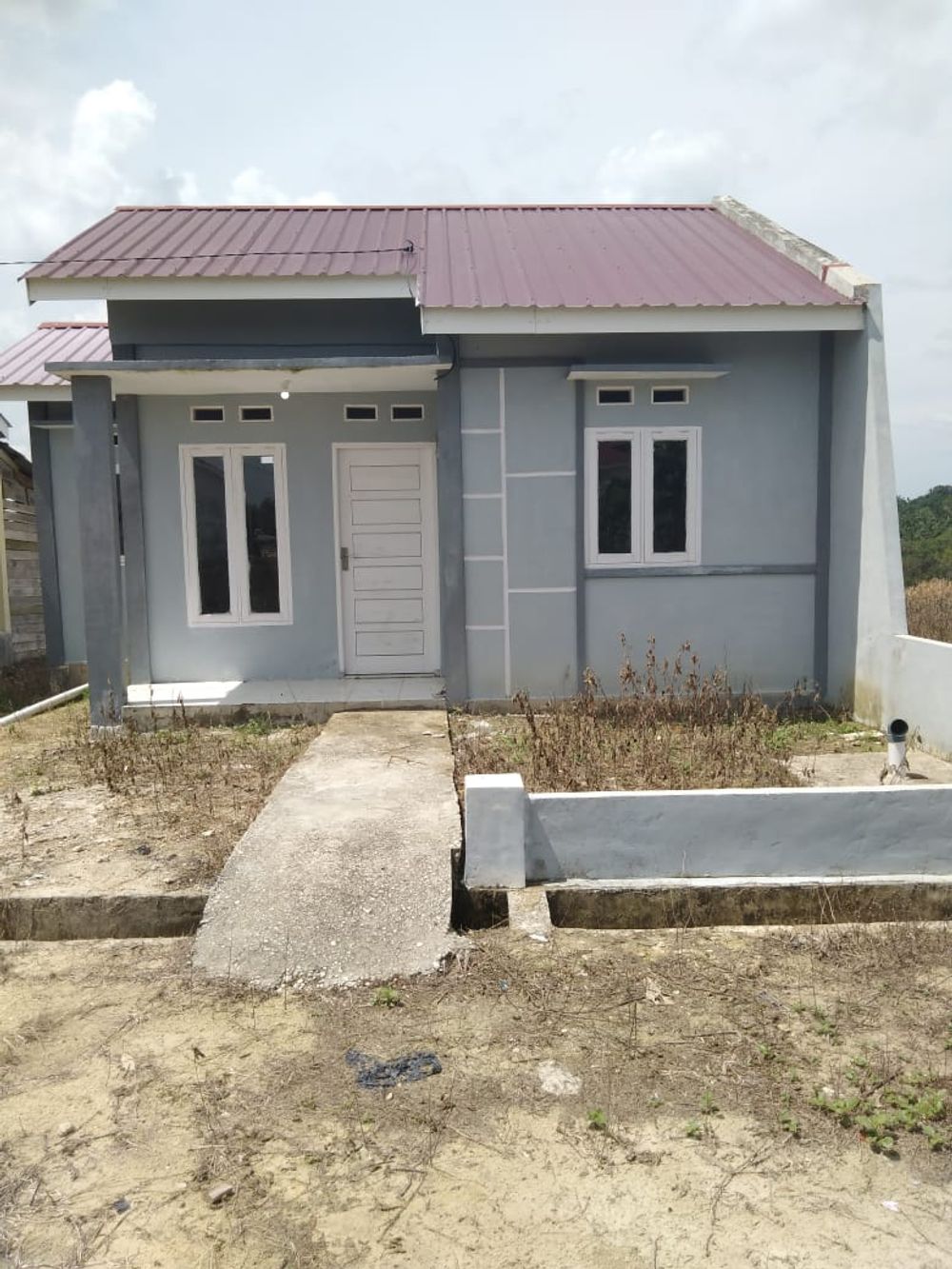 foto tampak rumah tipe Tunggal perumahan Budi Mulya Asri