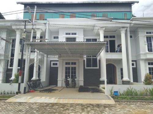 foto tampak rumah tipe Cluster Townhouse perumahan The Prestige Regency