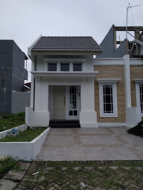 foto tampak rumah tipe TITLIS VILLA perumahan CITRALAND MANADO
