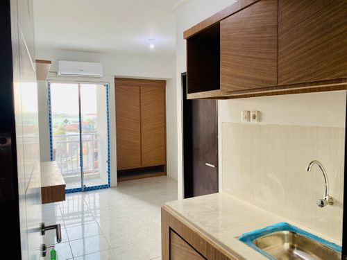 foto tampak rumah tipe EXECUTIVE A perumahan Suncity Residence Apartemen