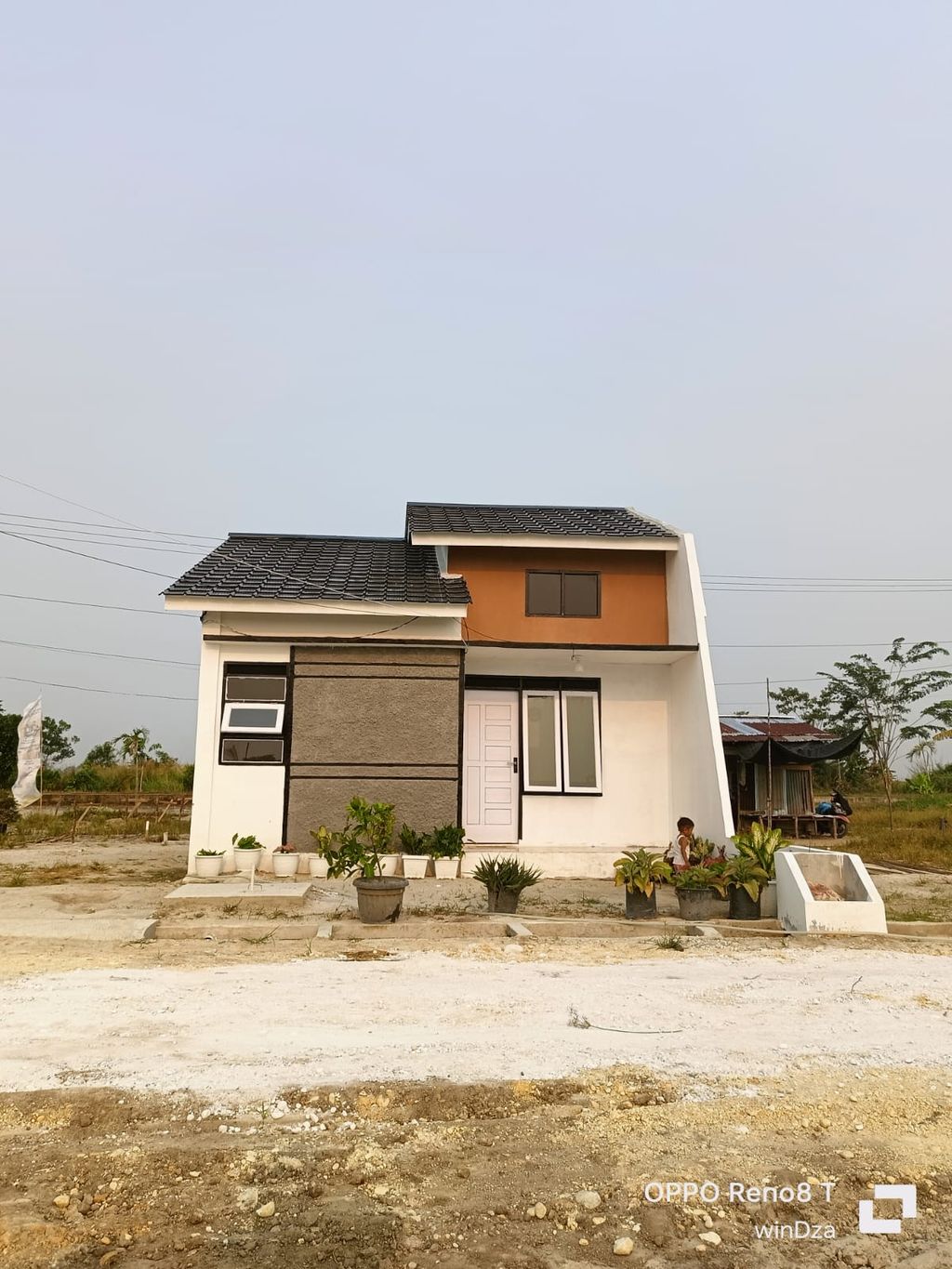 foto tampak rumah tipe 36/106 perumahan REZA TOWNHOUSE