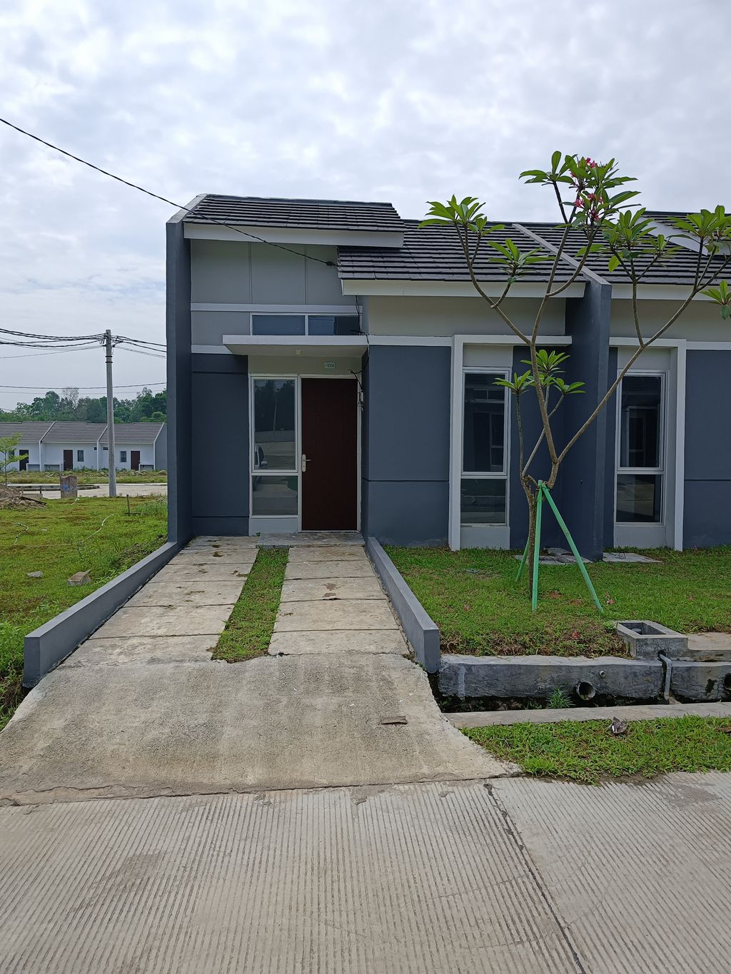 foto tampak rumah tipe RS 22 perumahan MODERNLAND CILEJIT-LINTANG