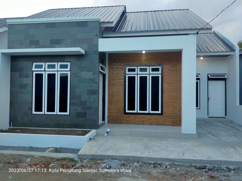 foto tampak rumah tipe Anggrek perumahan Puri Dimensi