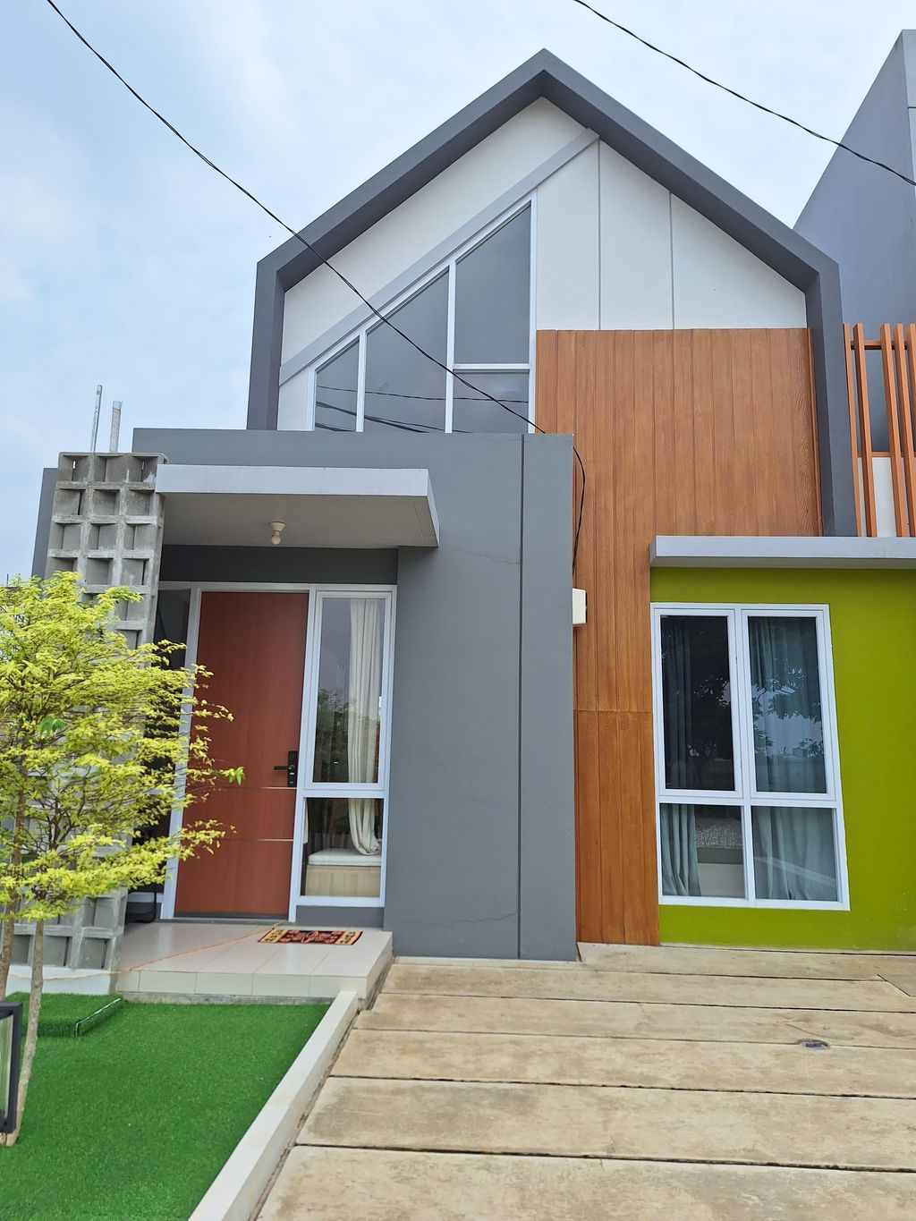foto tampak rumah tipe 66 Heliconia Mezzanine perumahan ORCHARD VILLAGE
