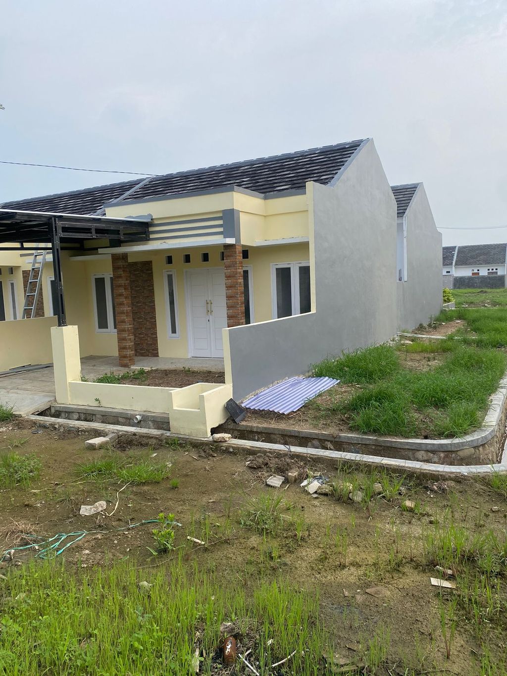 foto tampak rumah tipe 42/100 UTAMA HOOK perumahan PURI MUTIARA RESIDENCE