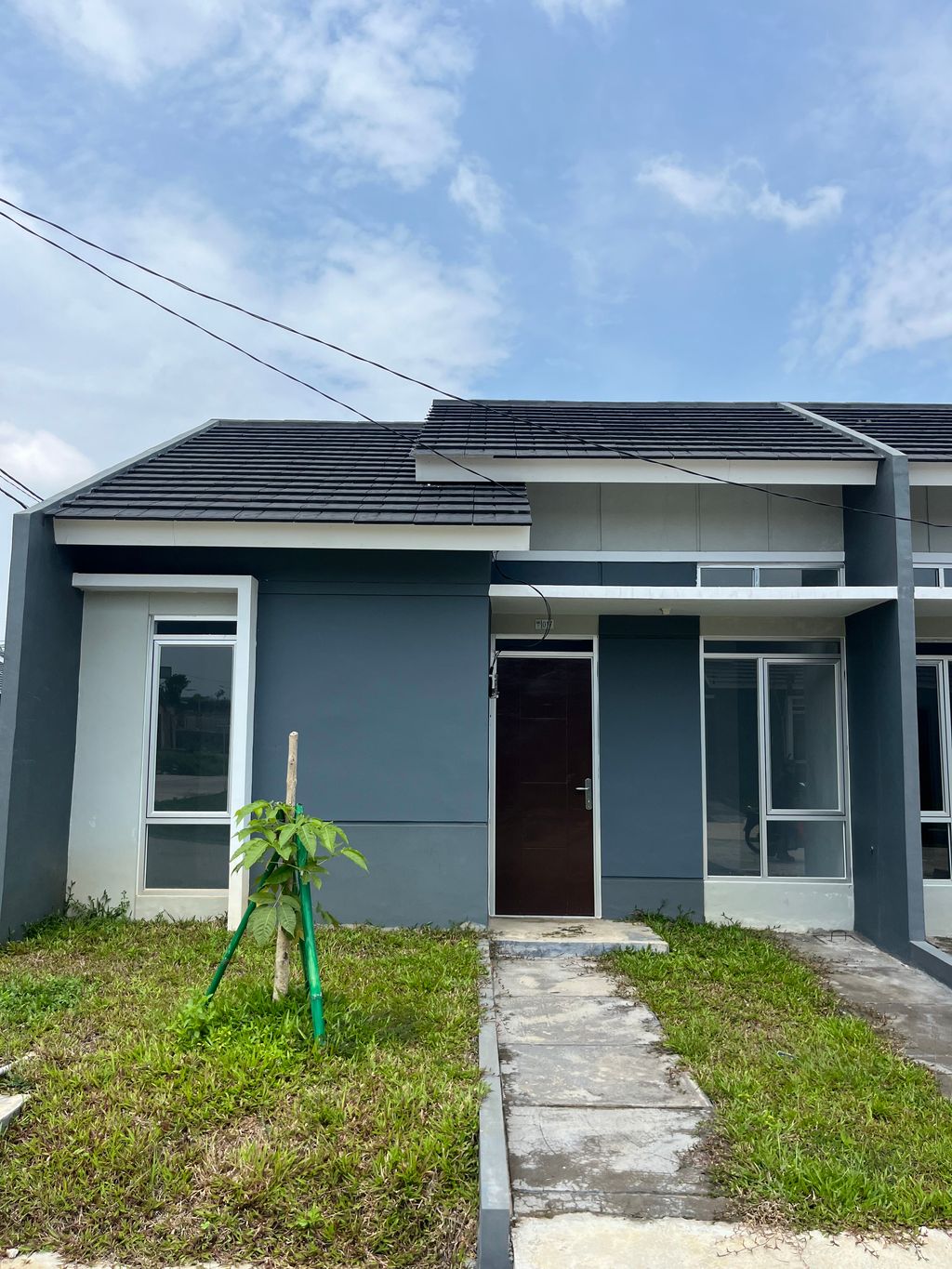 foto tampak rumah tipe RS 36/72 perumahan MODERNLAND CILEJIT-MERATUS