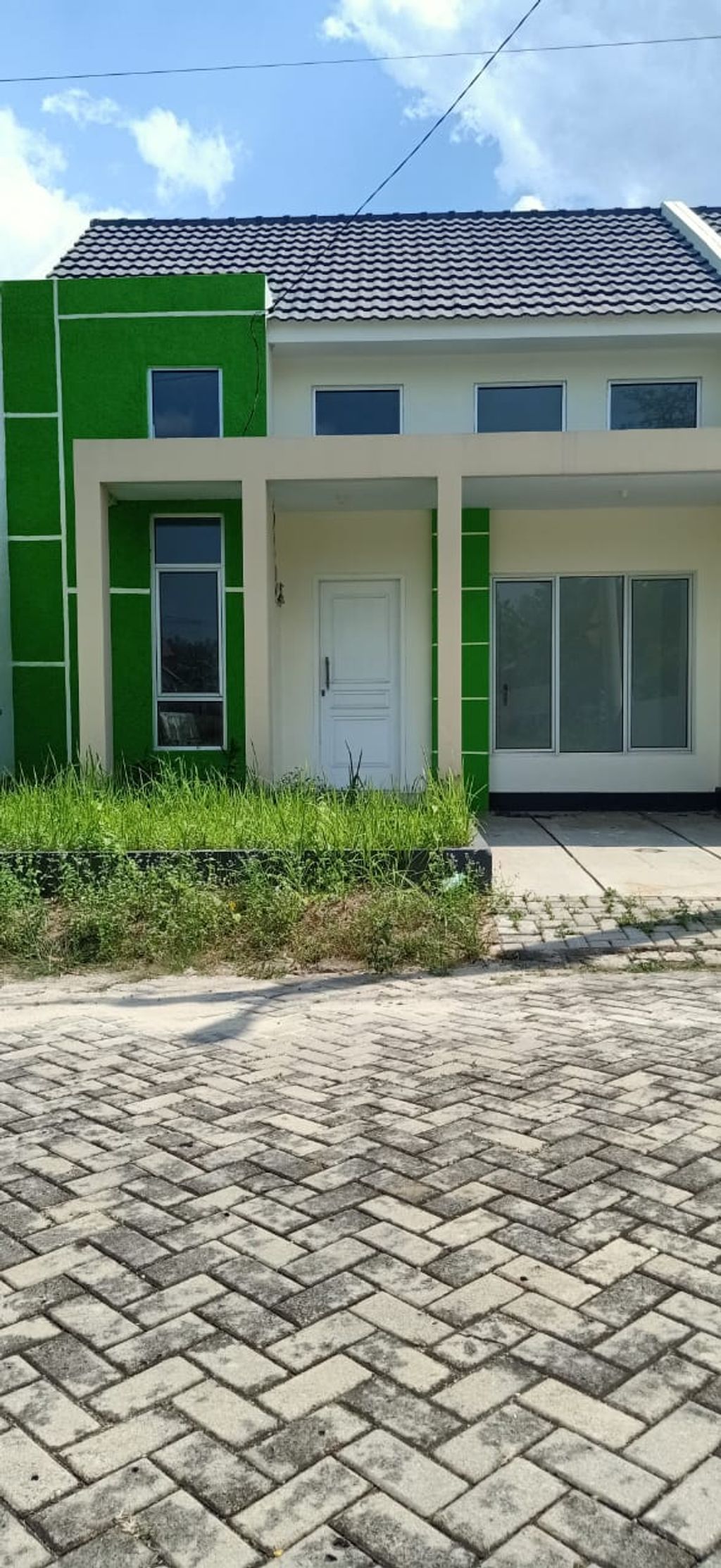 foto tampak rumah tipe ACASIA perumahan Pramuka Garden Residence