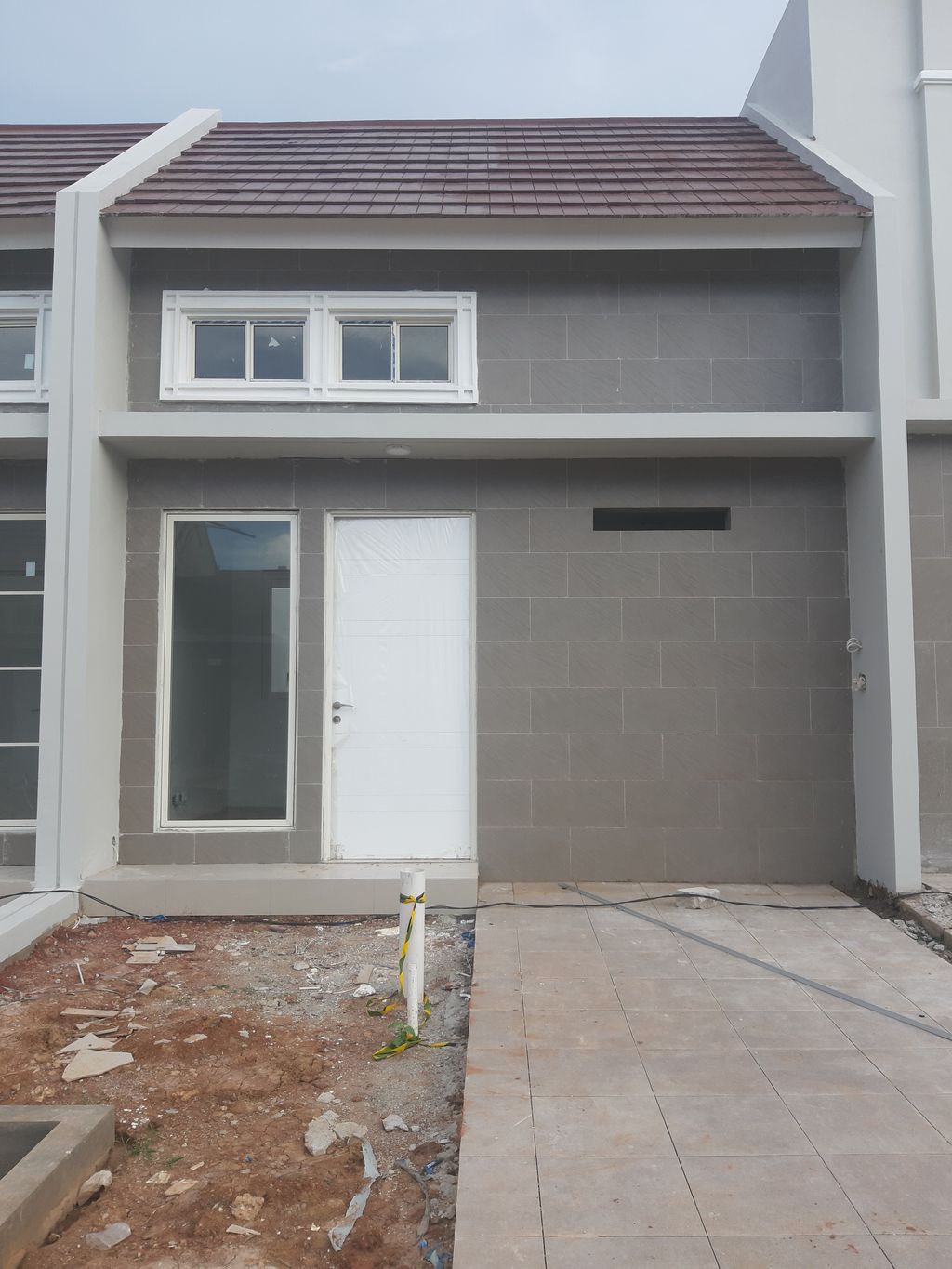 foto tampak rumah tipe 5X12(22) perumahan MILLENNIUM CITY TAHAP II