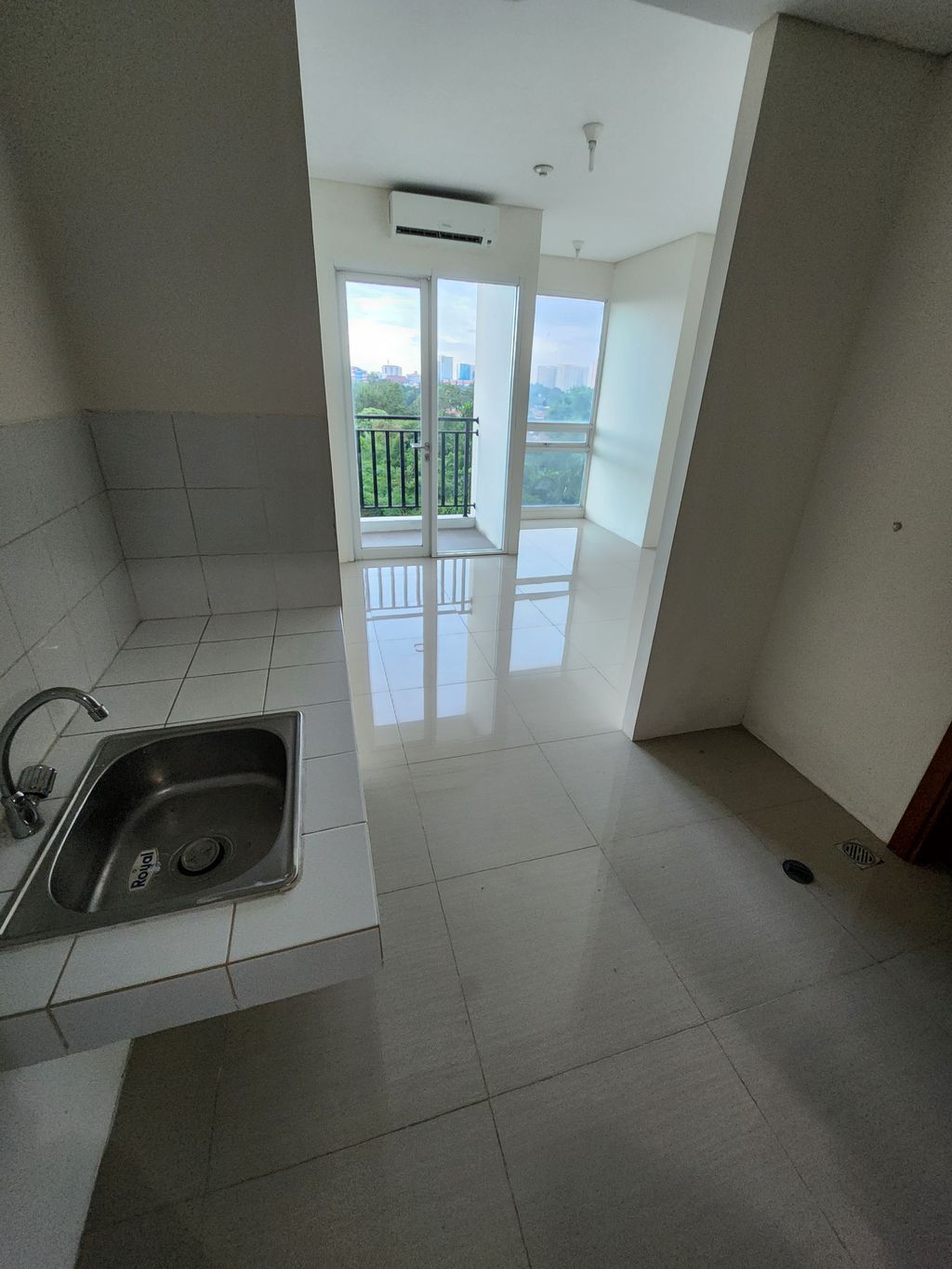 foto tampak rumah tipe Studio C perumahan Woodland Park Residence