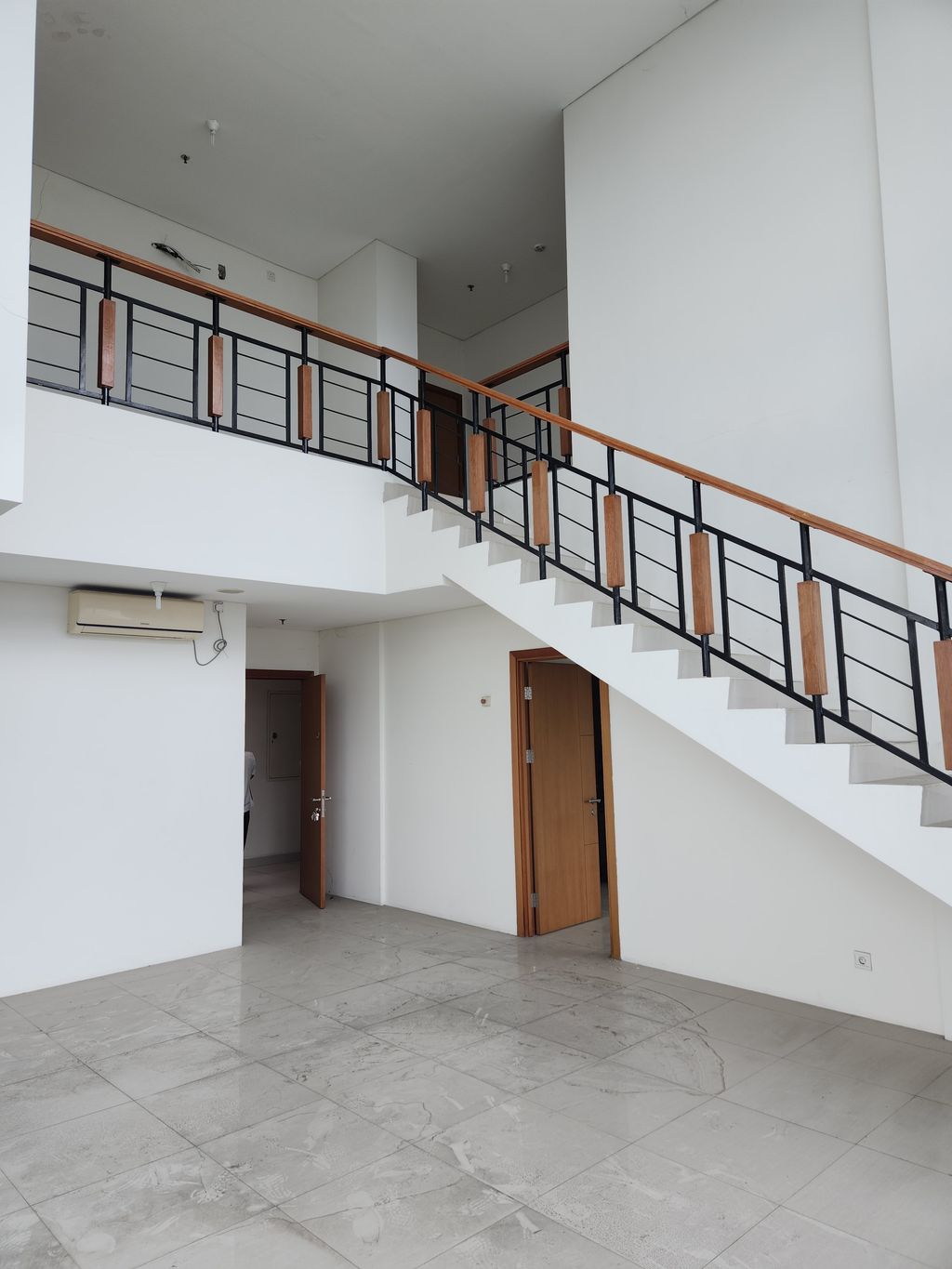 foto tampak rumah tipe Penthouse A perumahan Woodland Park Residence