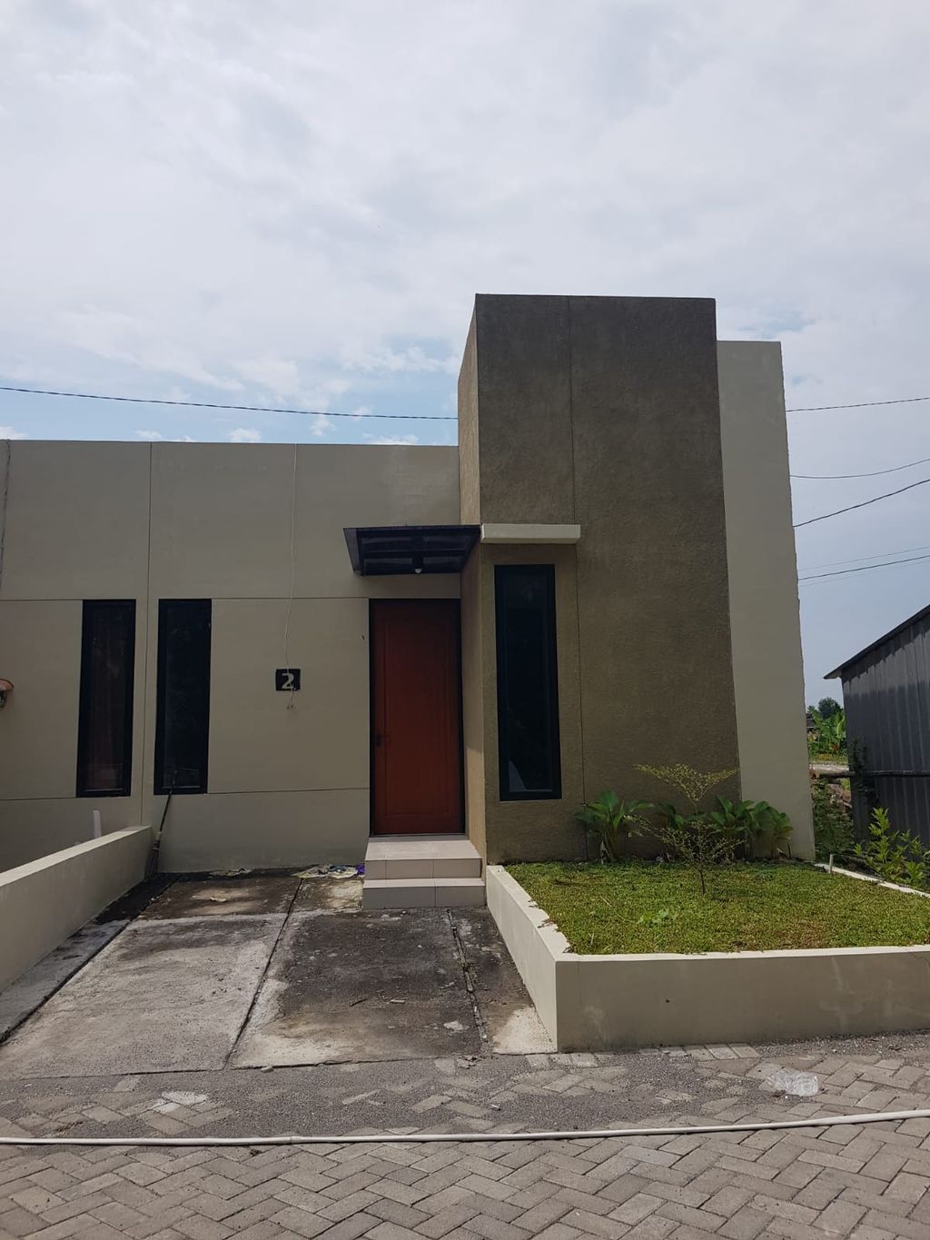foto tampak rumah tipe LOTUS A perumahan Casa Primera Kroyo