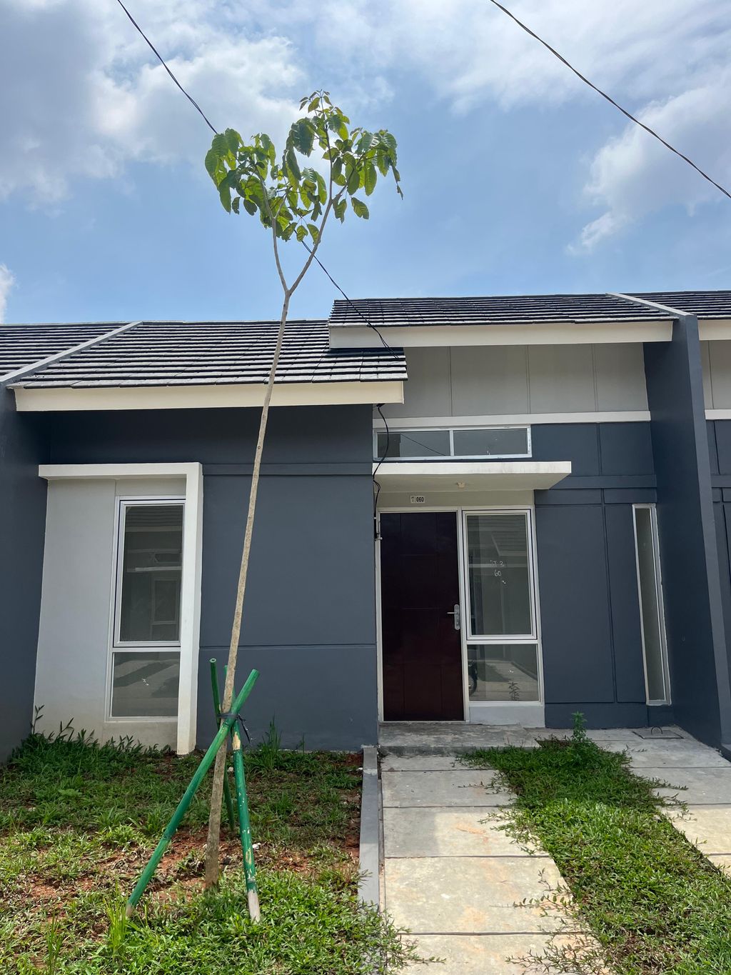 foto tampak rumah tipe RS 27/108 (PB8/01) perumahan MODERNLAND CILEJIT-PASAI BARAT