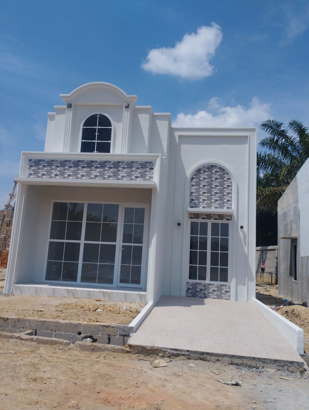 foto tampak rumah tipe 45 TOWNHOUSE perumahan SAHARA RESIDENCE 3