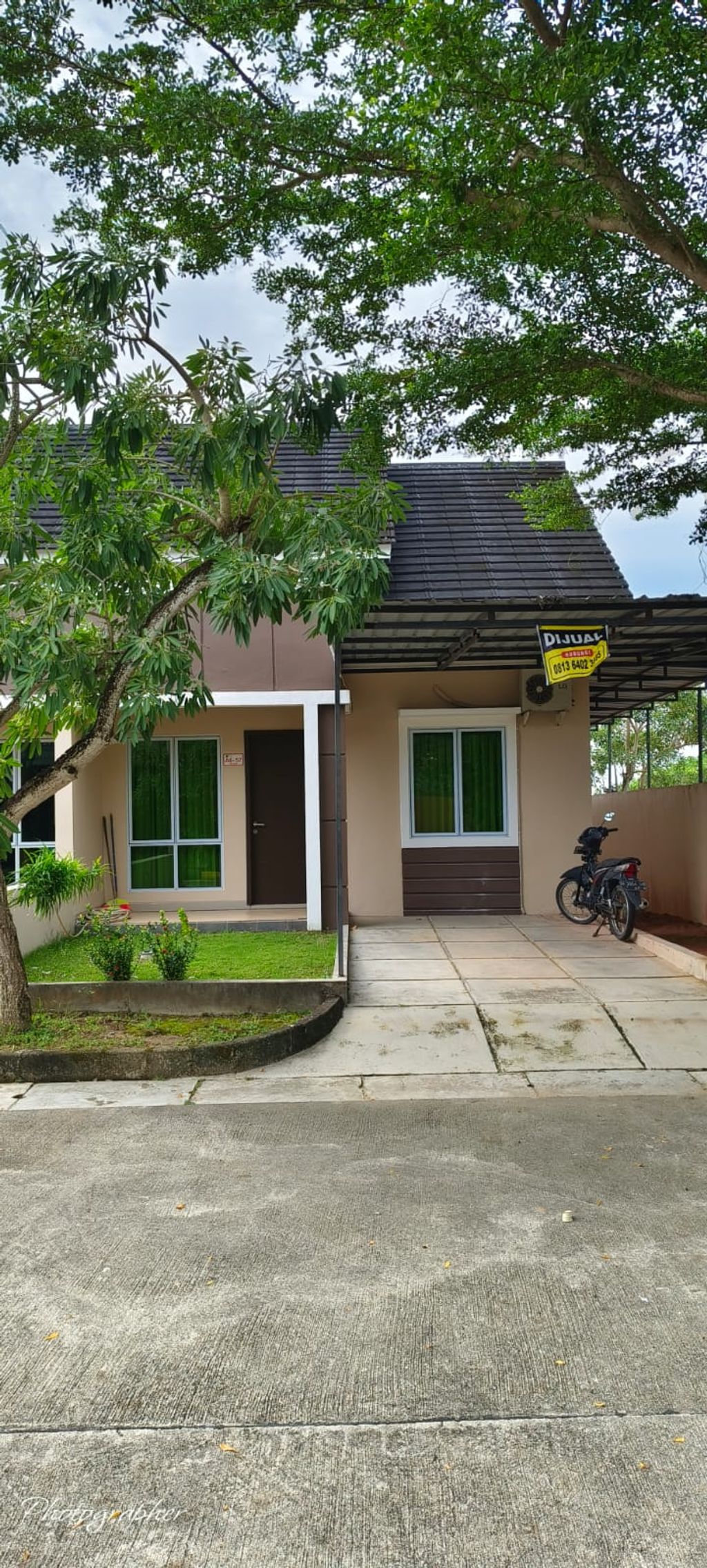 foto tampak rumah tipe Anggrek 58 No.57 perumahan KOMPLEK D'GREEN CITY TIPE 58 CLUSTER ANGGREK