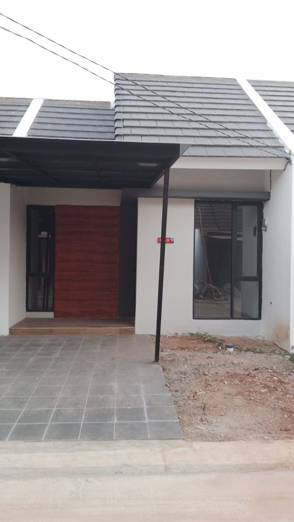 foto tampak rumah tipe FRESIA LITE 415 perumahan Mutiara Gading City Cluster New Liverpool Tahap 1