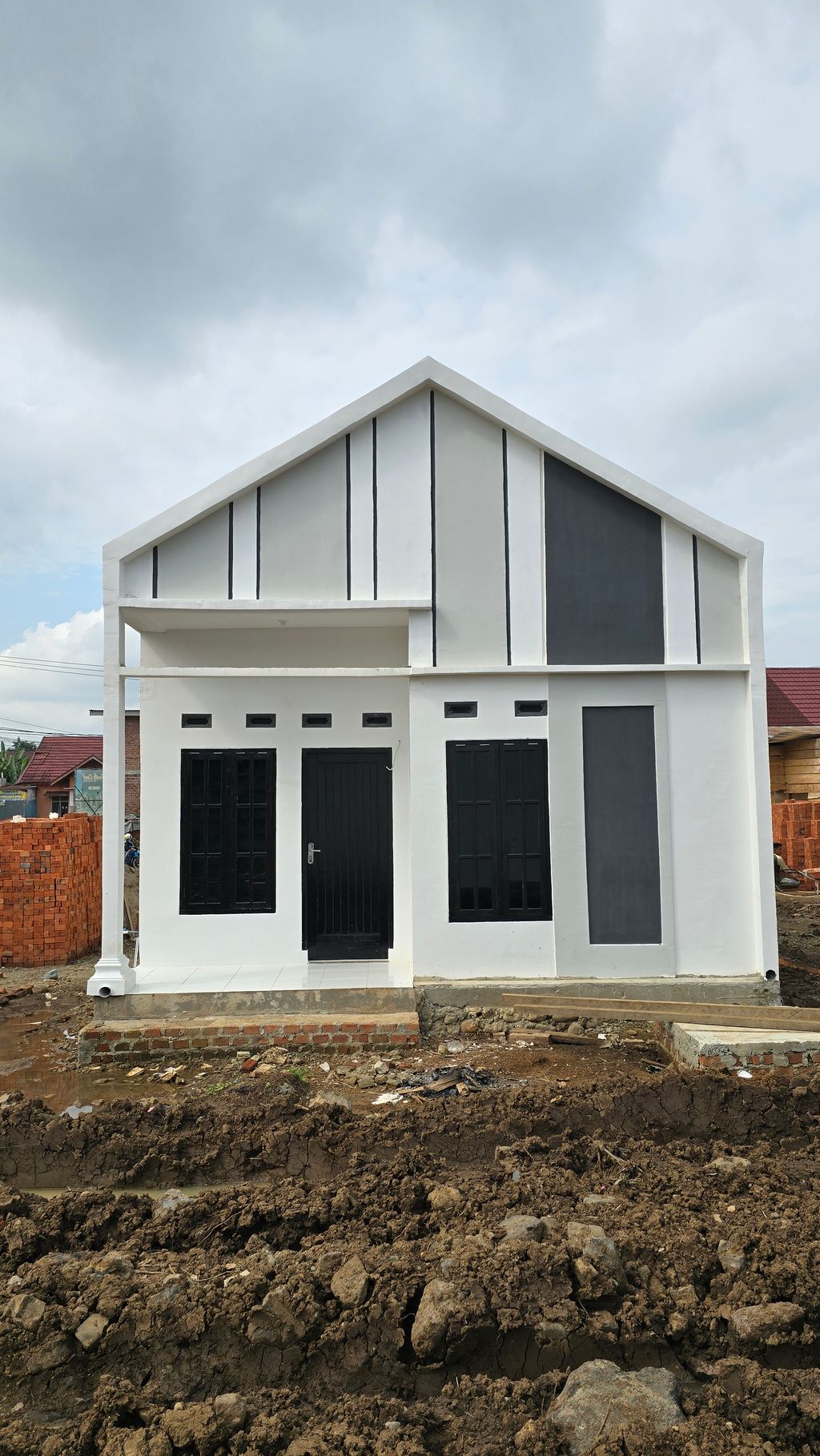 foto contoh rumah perumahan The Family Land