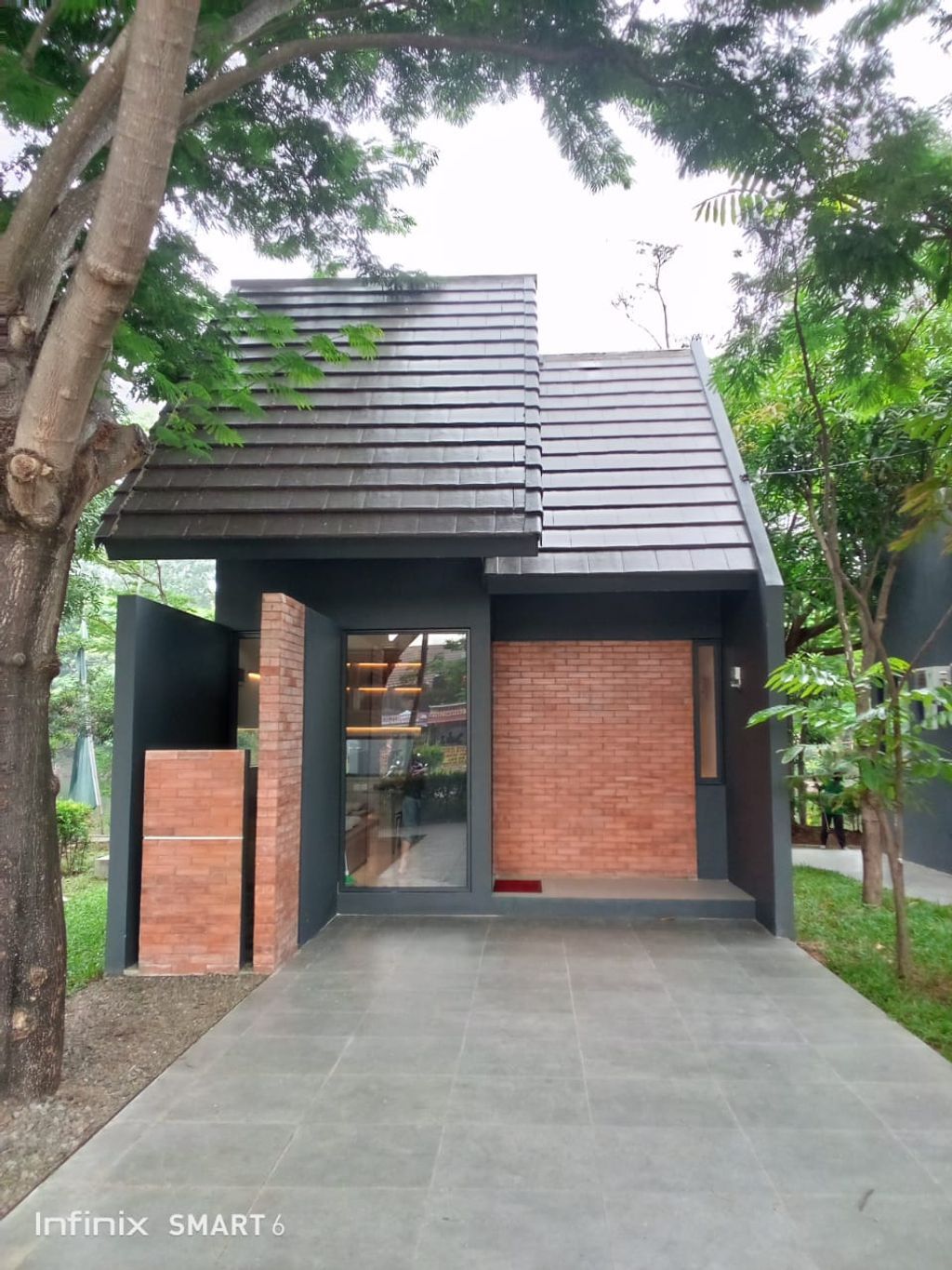 foto tampak rumah tipe LE VERRE 527 perumahan MUTIARA GADING CITY CLUSTER MONACO & PARIS