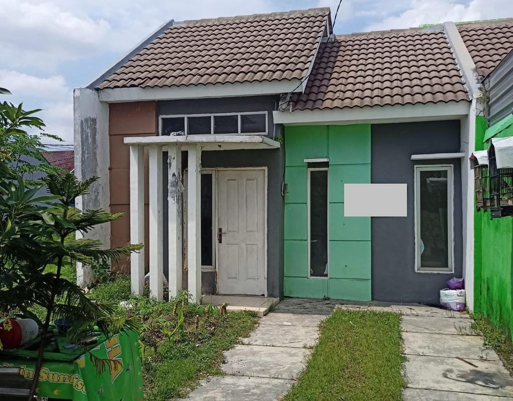 foto tampak rumah tipe SUNRISE PJ (36) perumahan PESONA SARI RESIDENCE