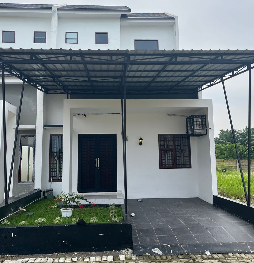foto tampak rumah tipe Jasmine perumahan Taman Asoka Asri Cluster Harvest