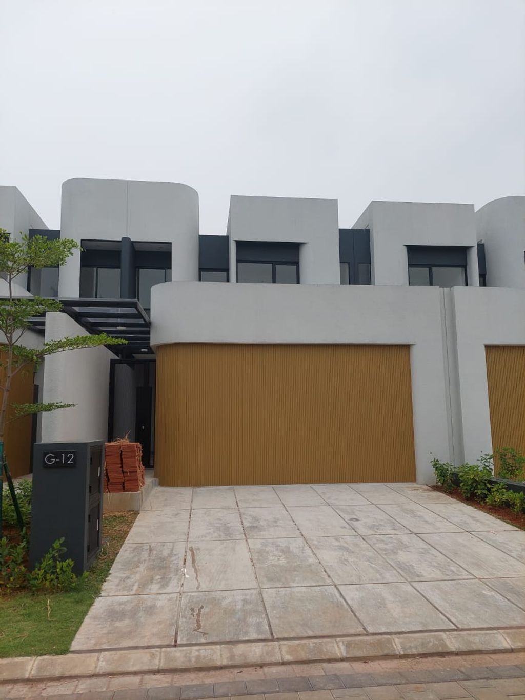 foto tampak rumah tipe TILIA G-012 - THE COURTYARD perumahan Shila At Sawangan