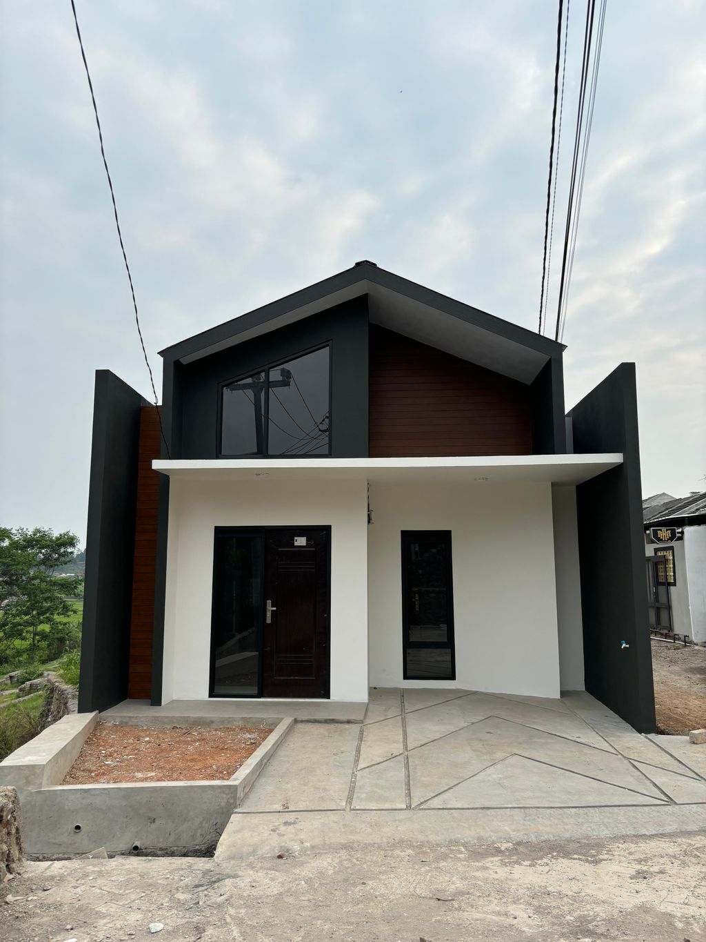 foto tampak rumah tipe PRESTIGE perumahan Hukoci Green Residence