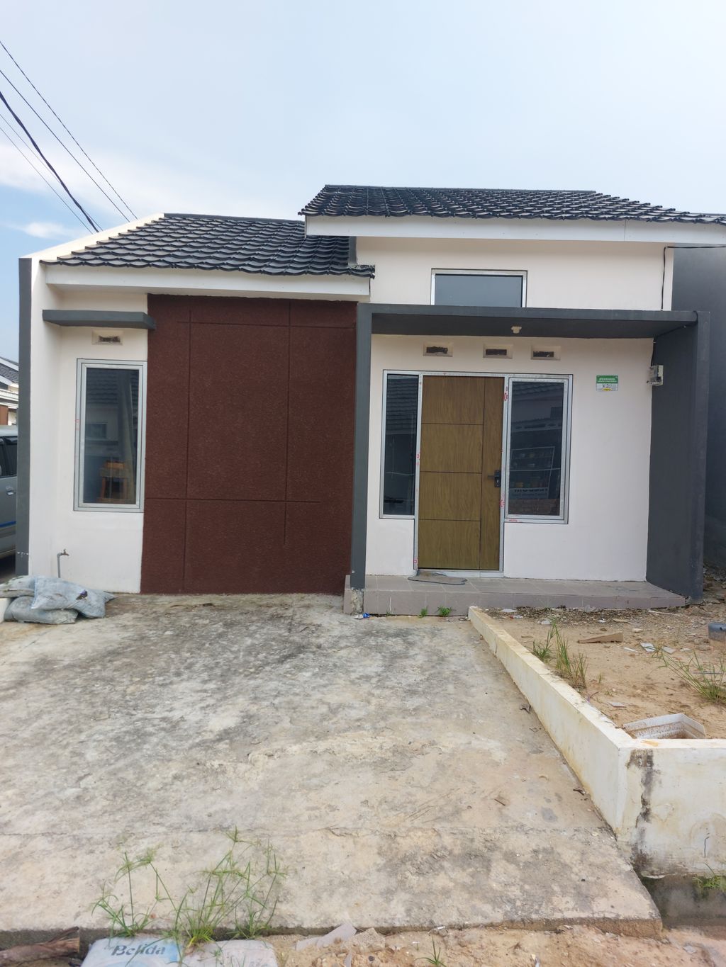 foto tampak rumah tipe 36 perumahan PURI INDAH ALAM BARAJO