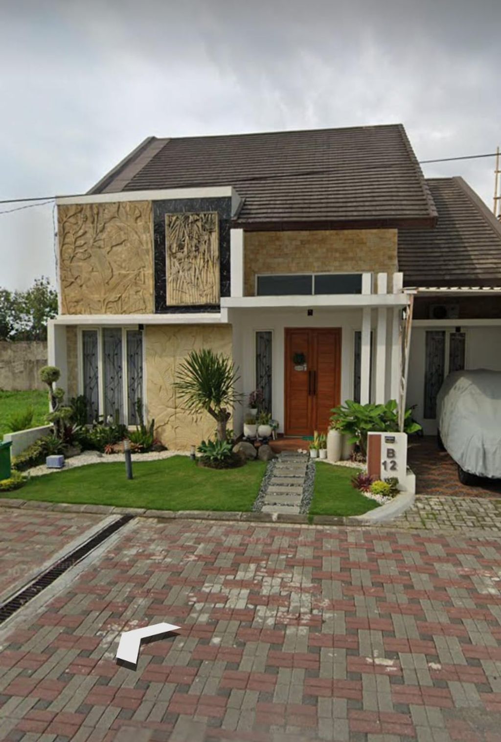 foto tampak rumah tipe 135/417 perumahan GRAND PANCA ARGA