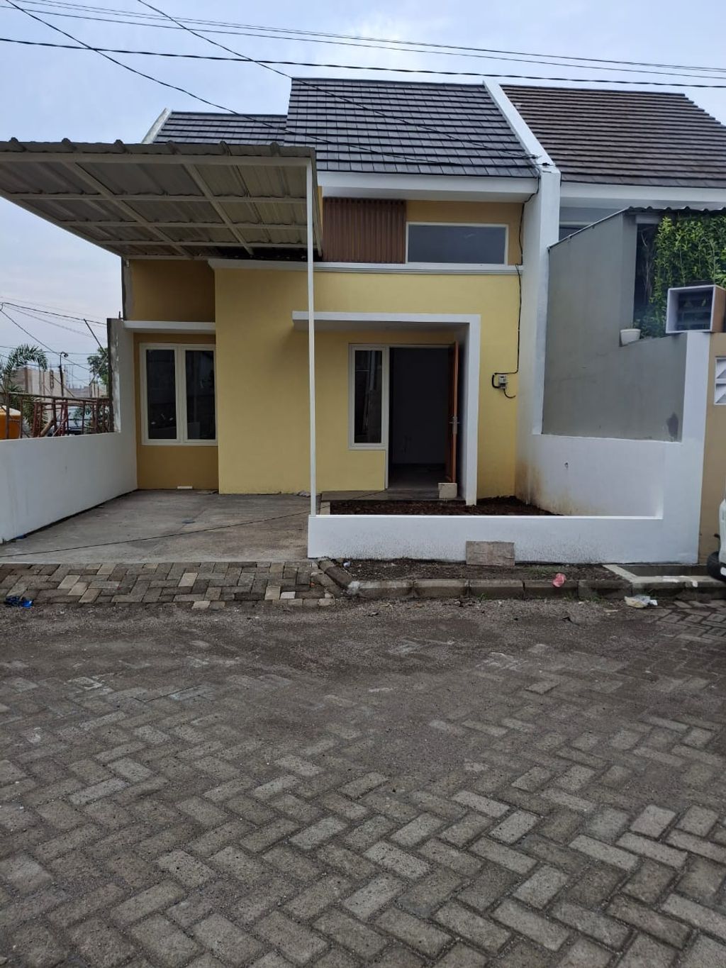 foto tampak rumah tipe 38/142 perumahan PALM VILLE REGENCY