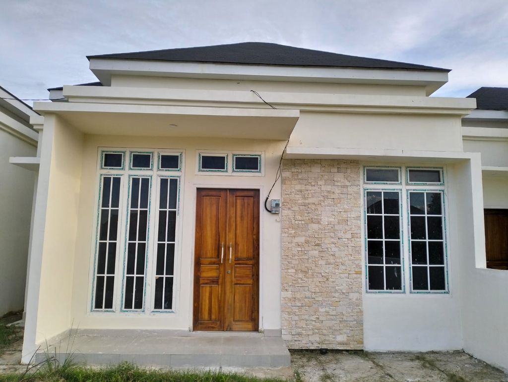 foto tampak rumah tipe 45 perumahan PERUMAHAN ADE GRAHA BUMI ASRI