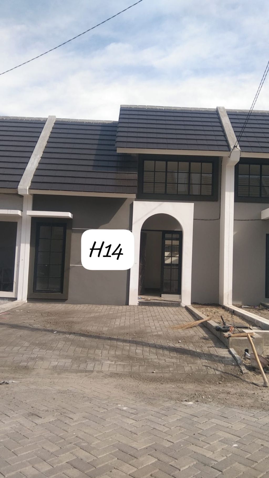 foto tampak rumah tipe Blok H-14 Fulton Cluster Kensington perumahan The Anvaya Juanda