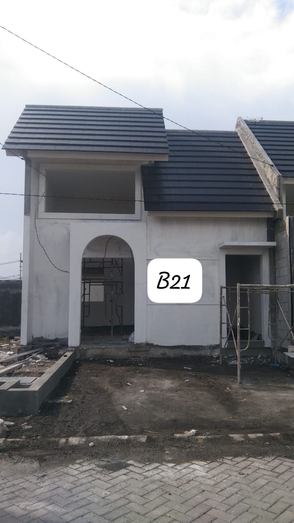 foto tampak rumah tipe Blok B - 21 Fulton Hook Cluster Kensington perumahan The Anvaya Juanda