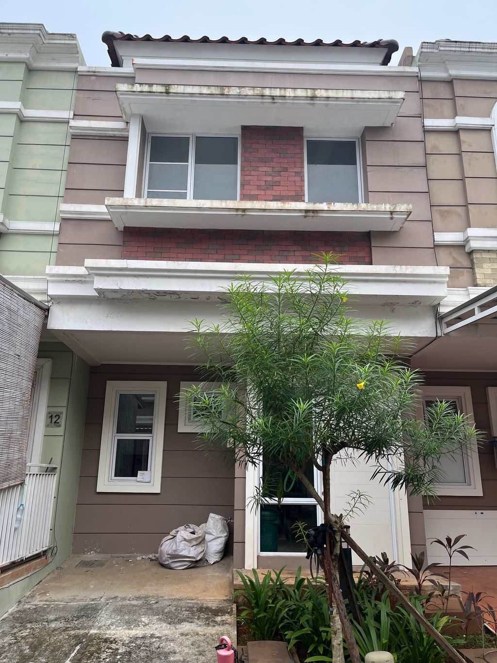 foto tampak rumah tipe HUDSON/10 perumahan CLUSTER AMARILLO VILLAGE