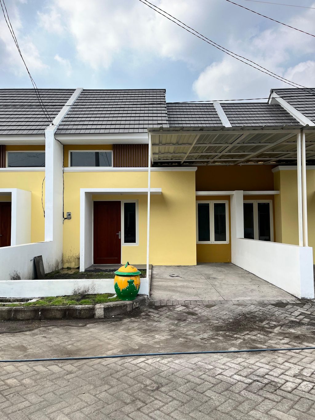 foto tampak rumah tipe 38/112 perumahan PALM VILLE REGENCY