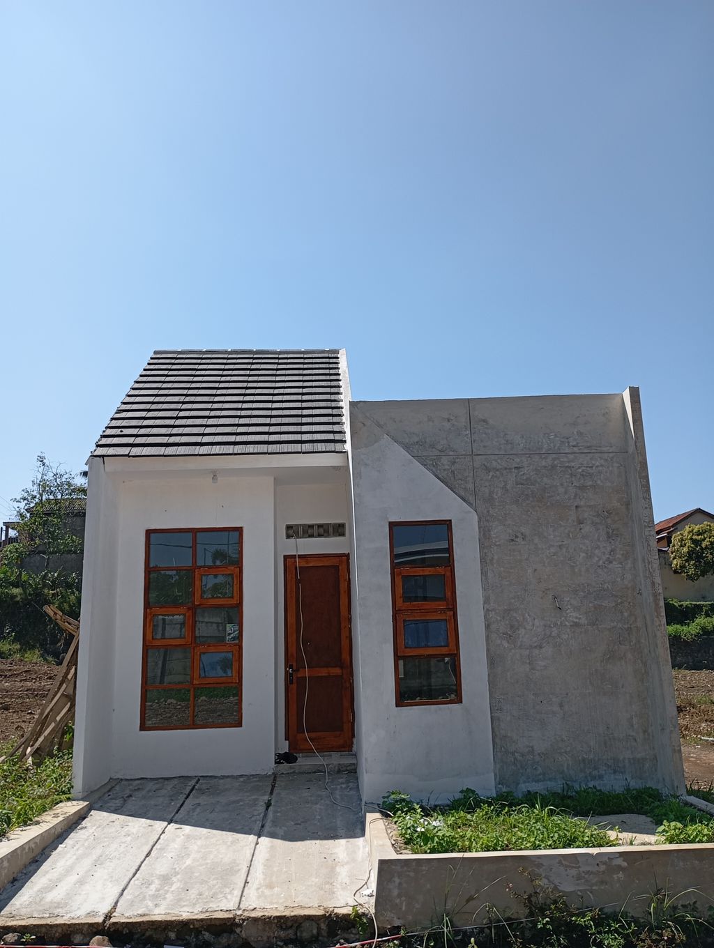 foto tampak rumah tipe SUBSUDI perumahan Restoe Boemi X HWD