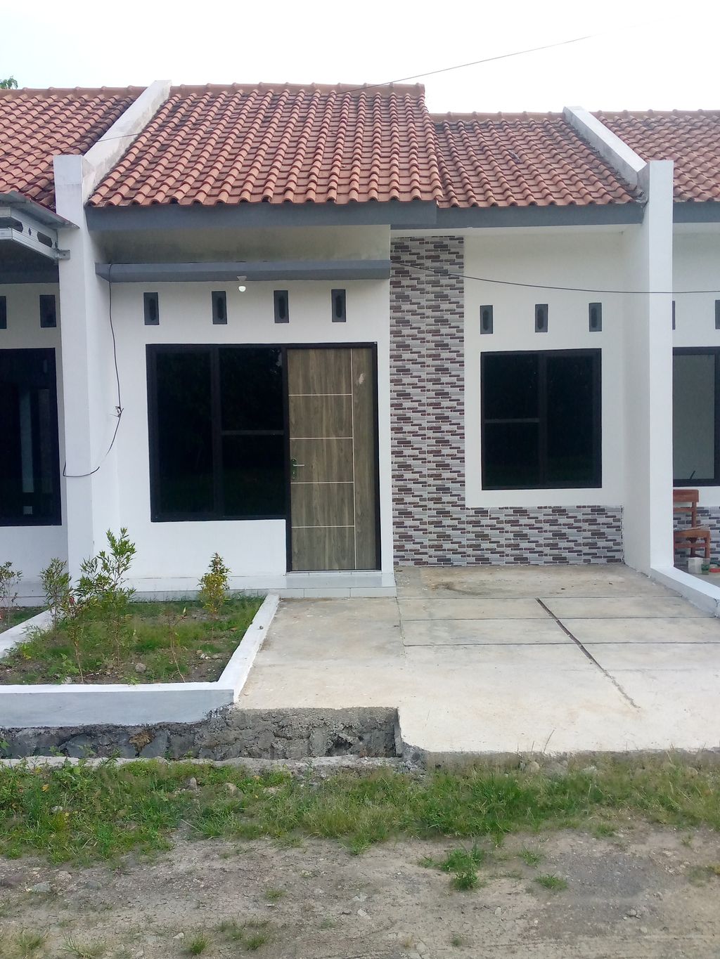 foto tampak rumah tipe Standart 30 perumahan GRAHA LUMBUNG MAS