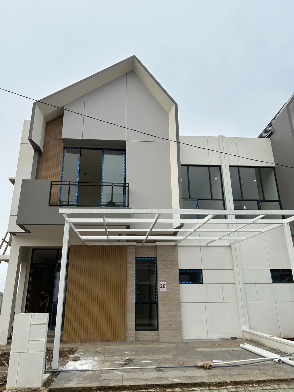 foto tampak rumah tipe ABELIA SUDUT perumahan CLUSTER AGRA, SUVARNA SUTERA