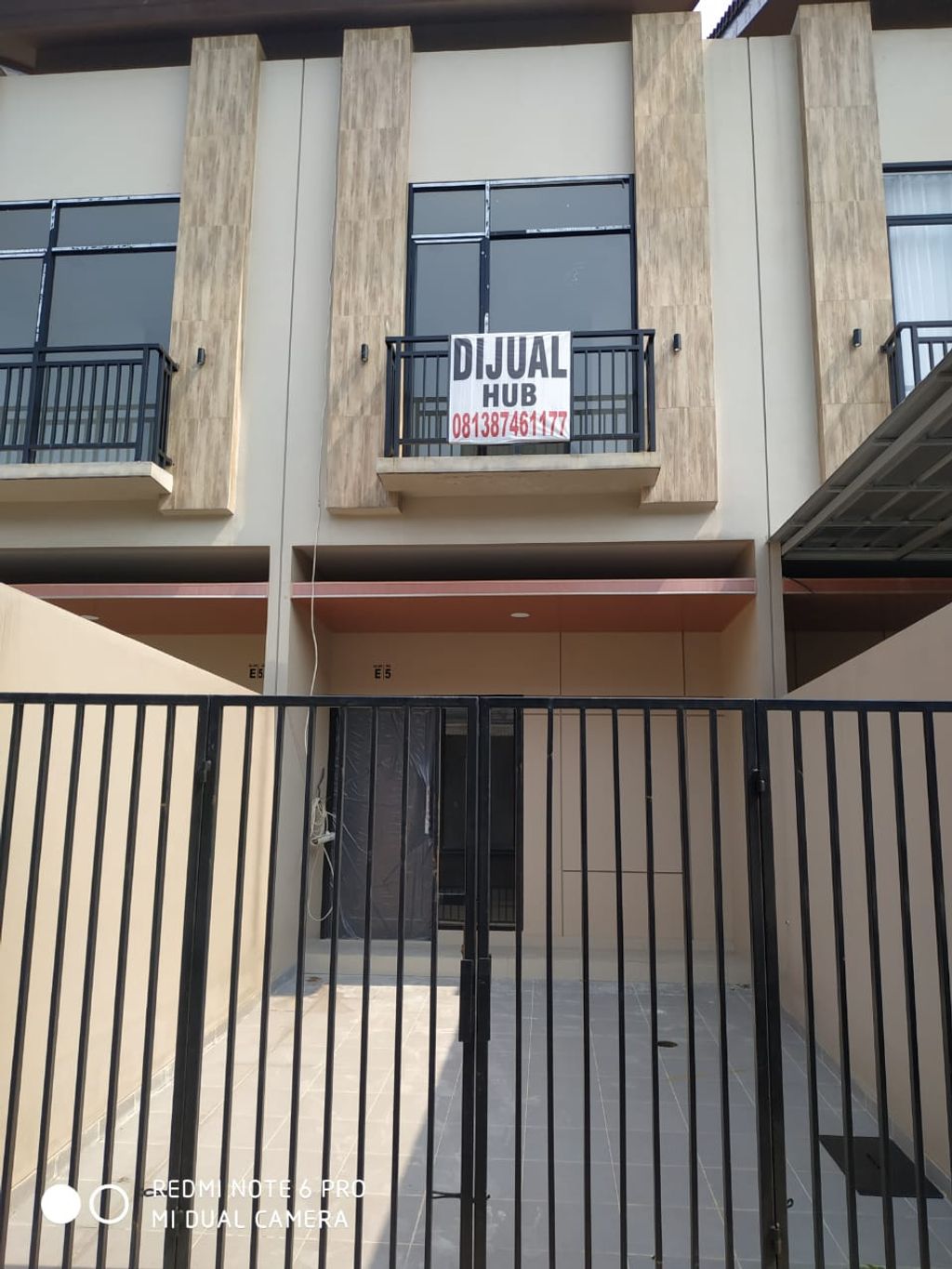 foto tampak rumah tipe 98/64 perumahan Klingkit Raya Residence