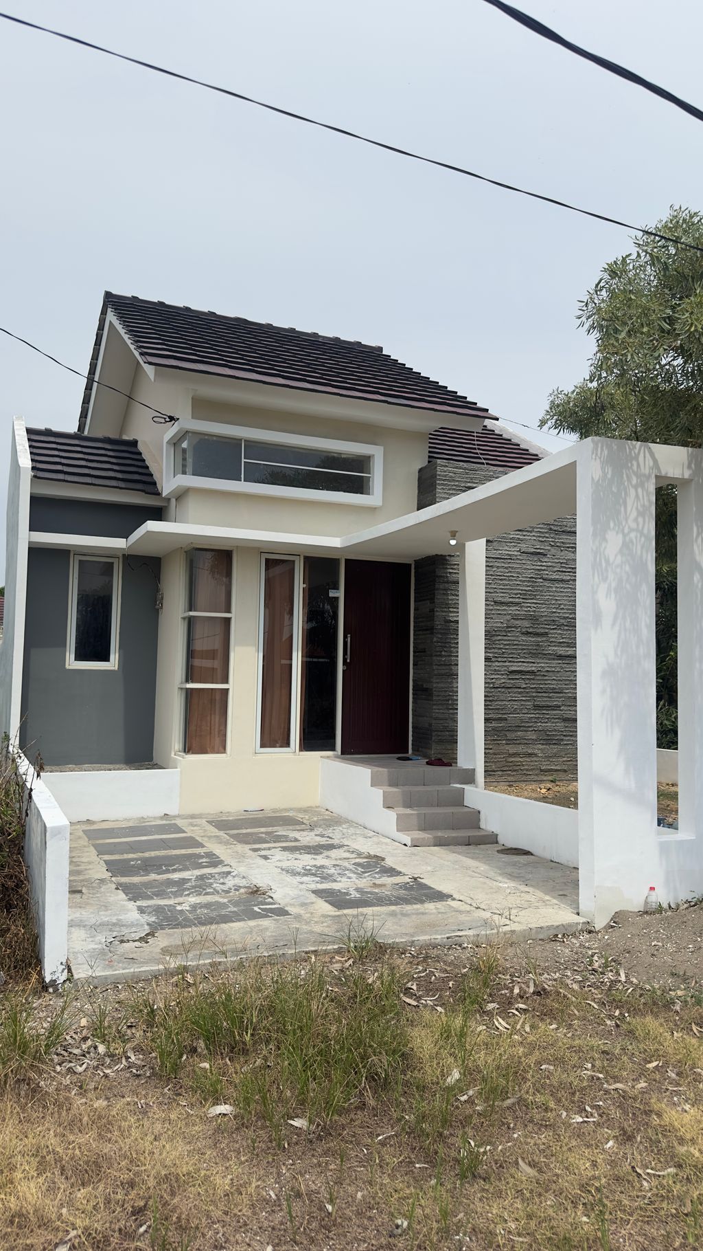 foto tampak rumah tipe Tulip 45/100 perumahan GRAND WASTANA RESIDENCE