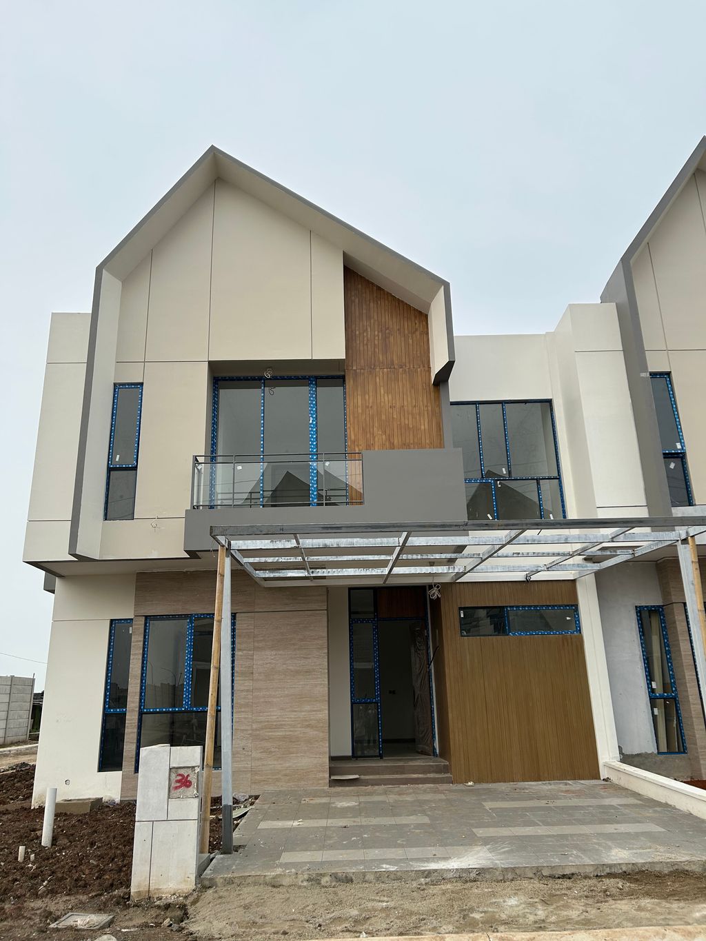 foto tampak rumah tipe AMARYLLIS SUDUT perumahan CLUSTER AGRA, SUVARNA SUTERA