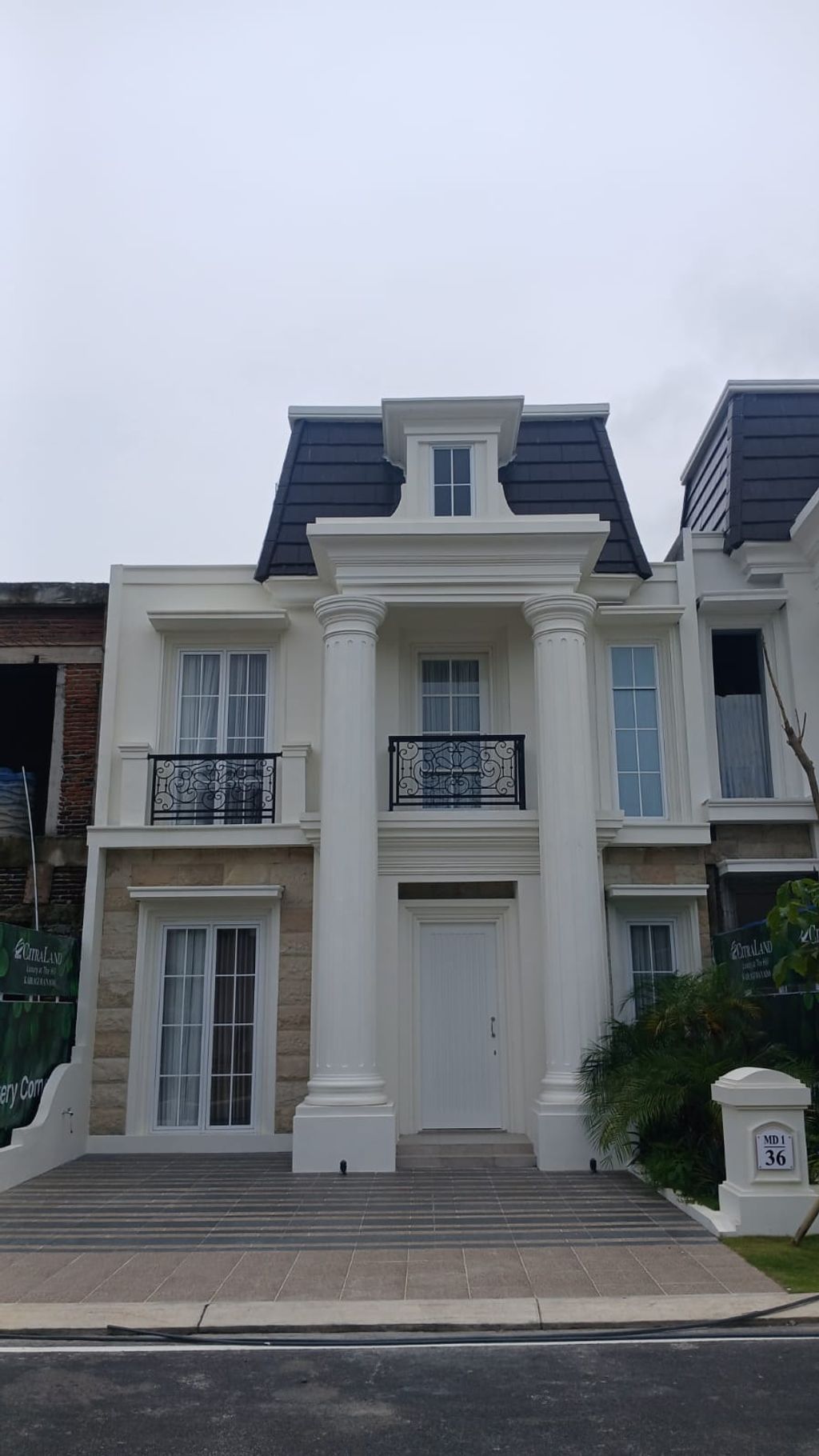 foto tampak rumah tipe NEW EDINBURGH perumahan CITRALAND KAIRAGI MANADO