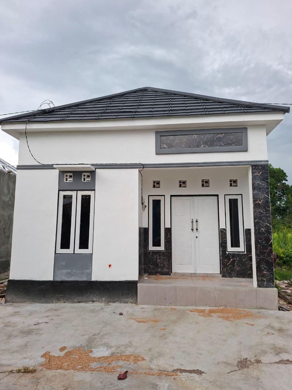 foto tampak rumah tipe 36 WMP GOLF INDAH II perumahan WENGGA METROPOLITAN