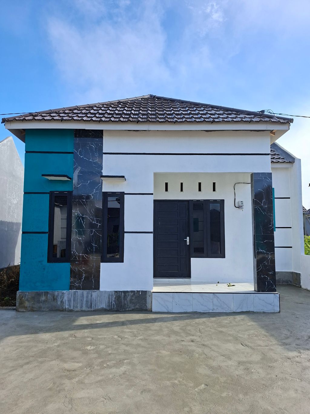 foto tampak rumah tipe 36 perumahan WMP9 SUTARTI
