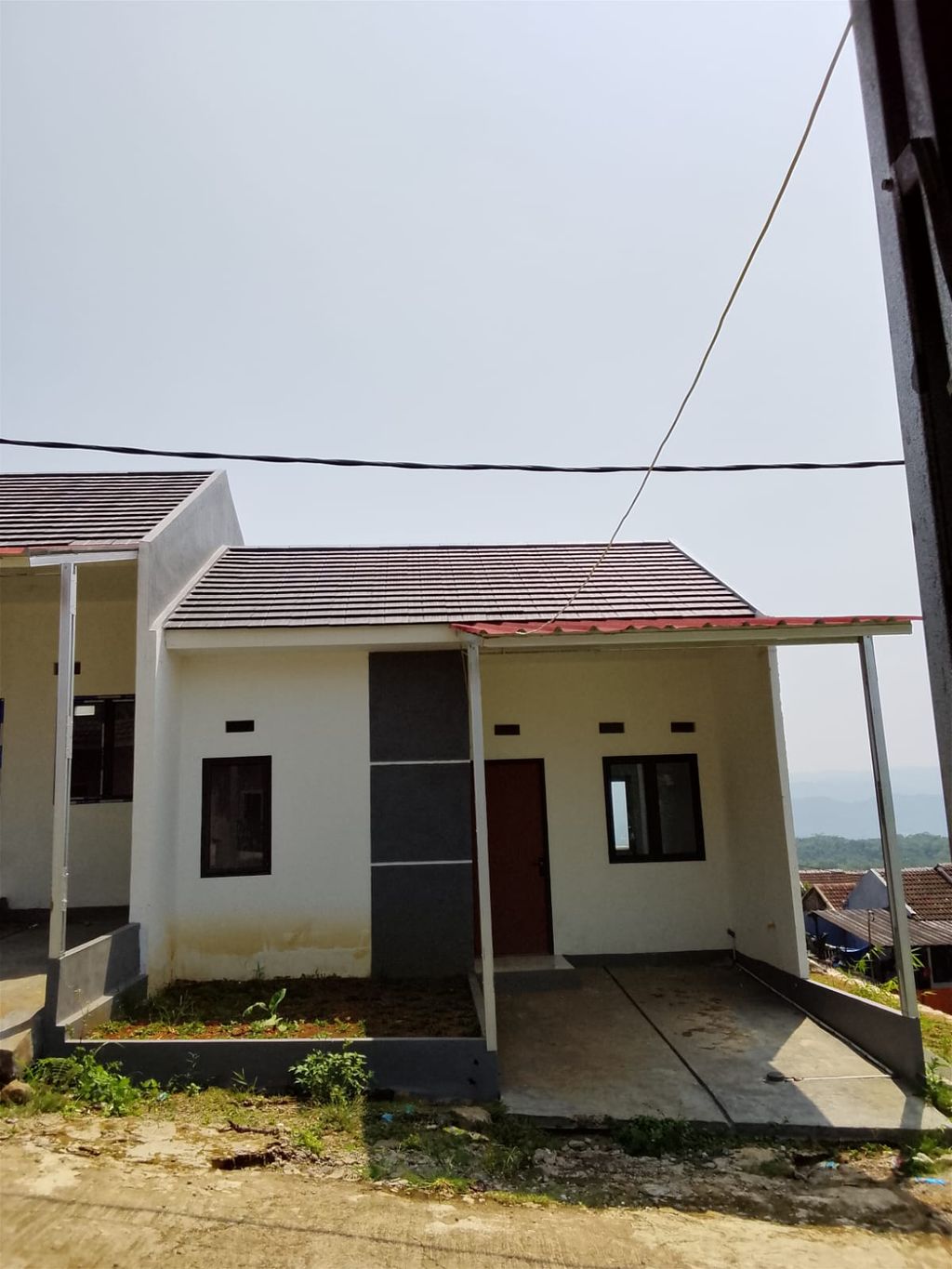 foto tampak rumah tipe 36/60 perumahan PESONA CIBEBER ASRI