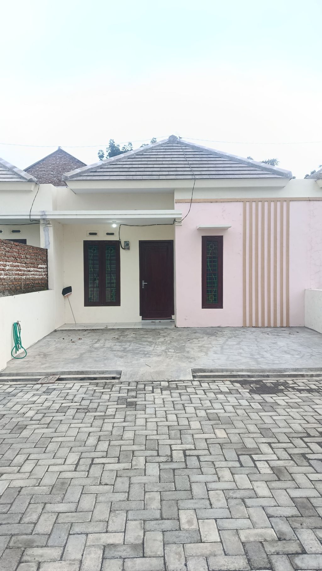 foto tampak rumah tipe 36/69 perumahan PALM GREEN RESIDENCE 2
